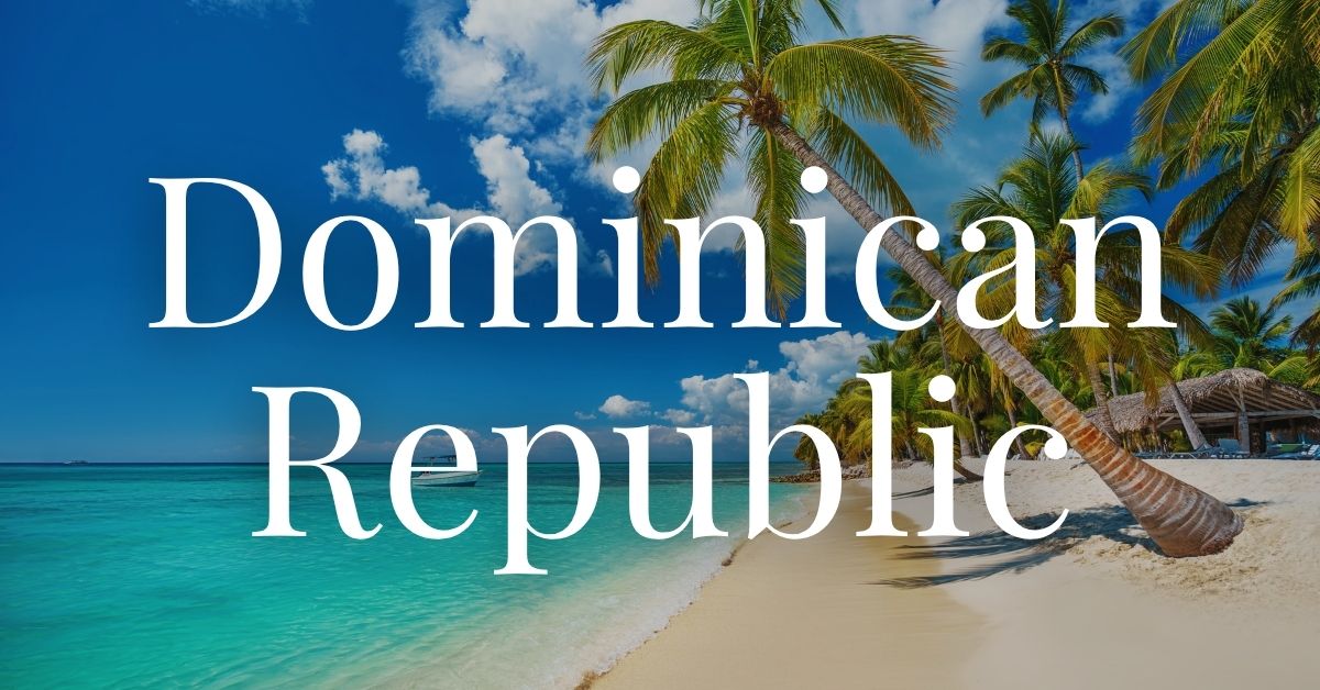 palm tree on the beach over the turquoise waters of the Dominican Republic