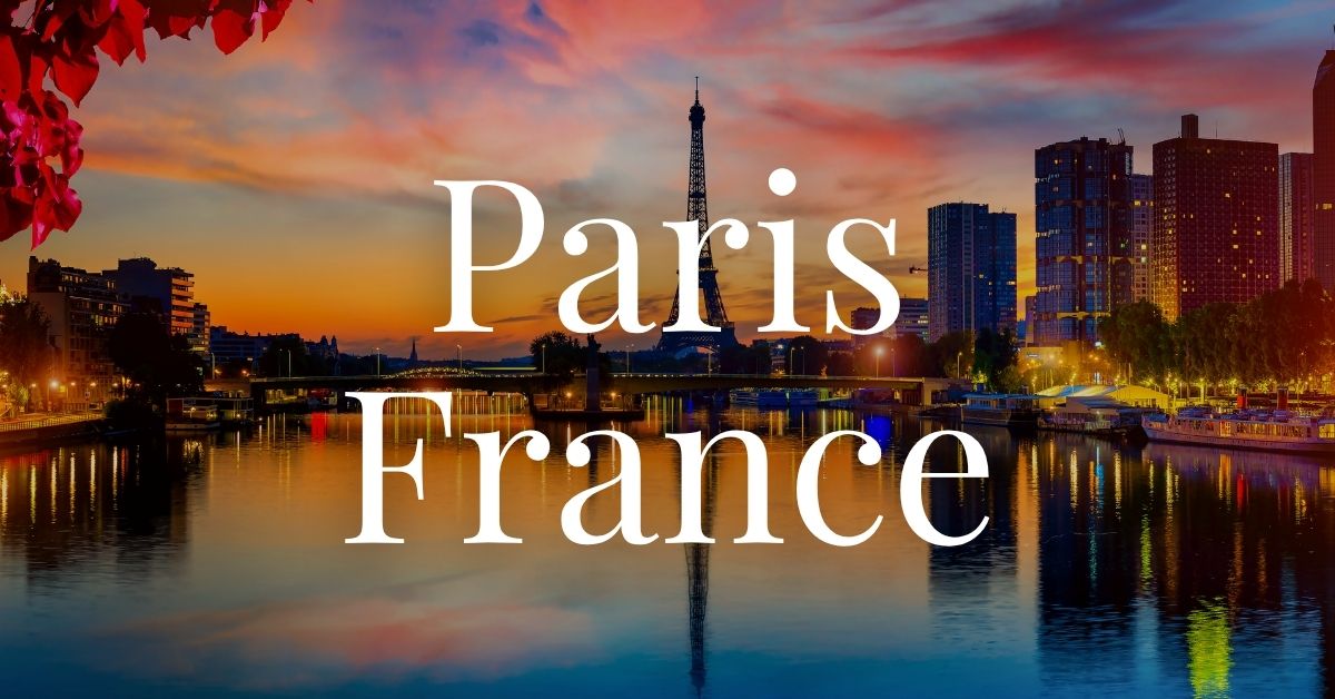 sunset in Paris with the Eiffel Tower reflecting in the water.