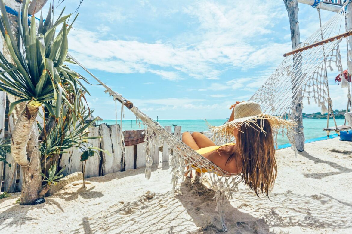 woman on beach in hammock