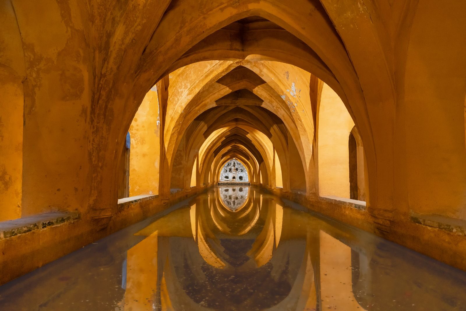 Reflective arches in the Baths of Maria de Padilla, Alcázar of Sevilla.