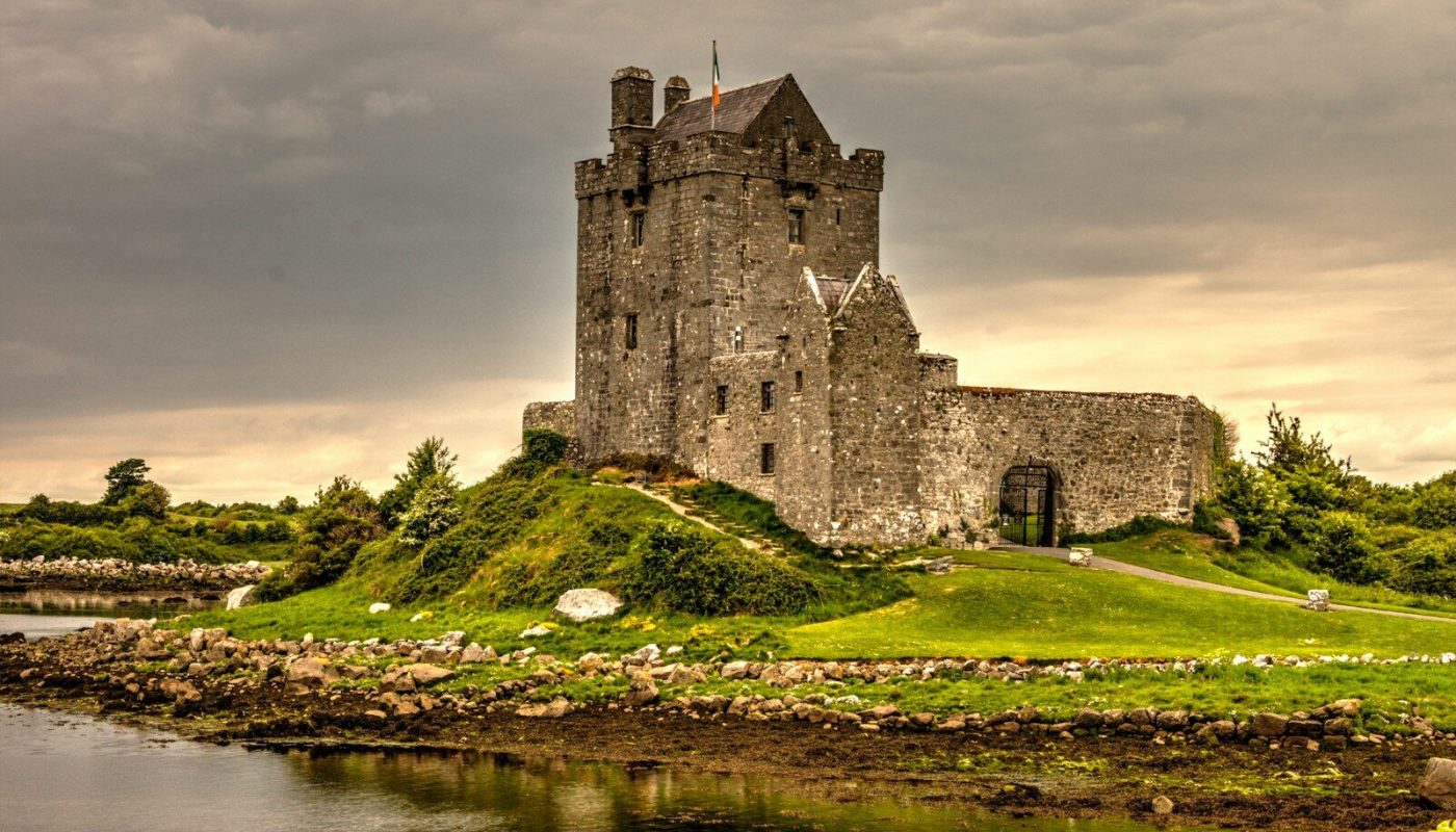 view photography of gray castle on island
