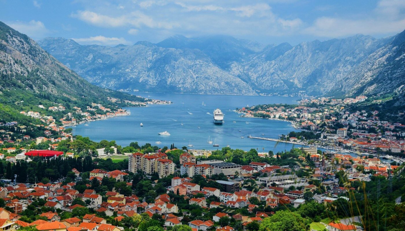 aerial view of city near body of water during daytime