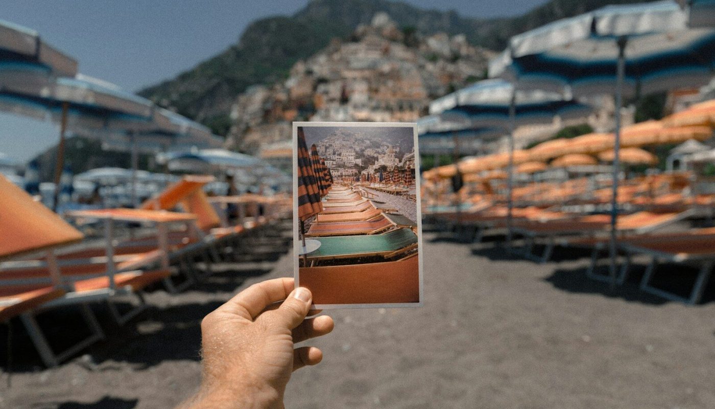 person holding outdoor lounge chairs photo